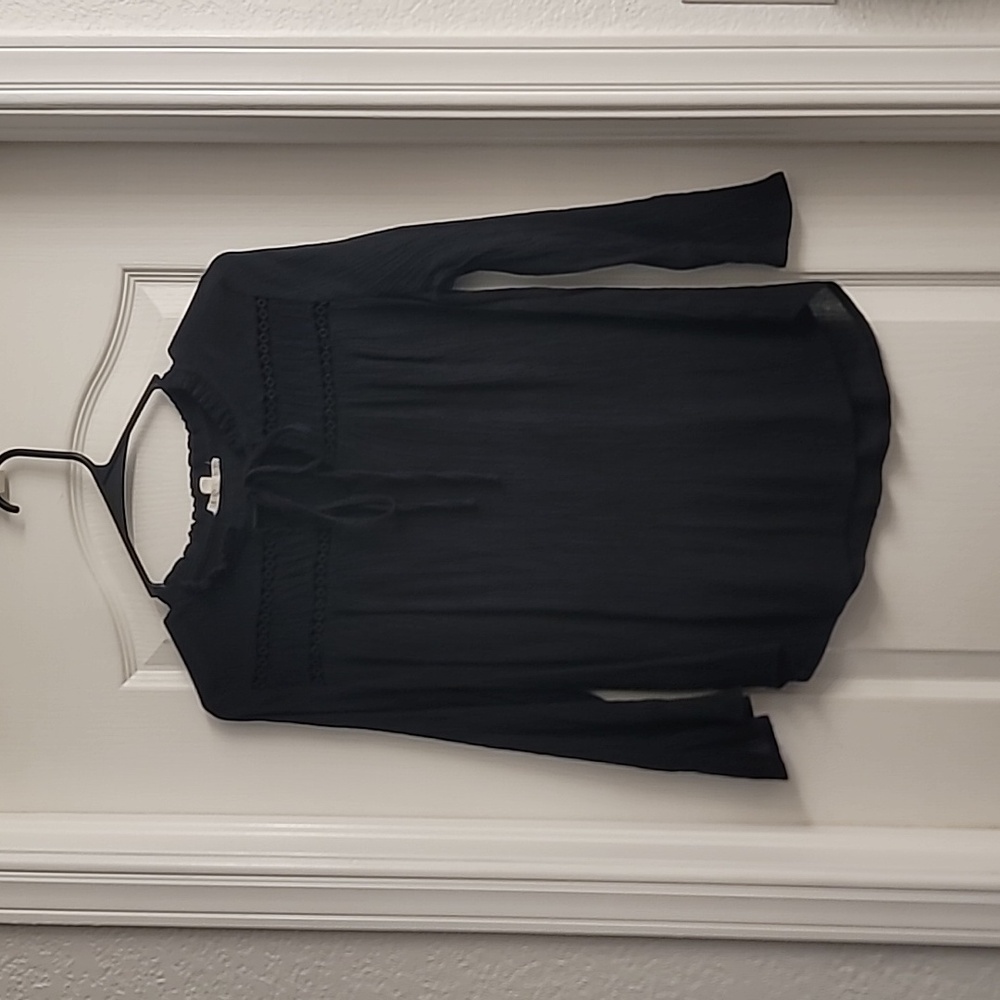 Black long sleeve blouse with tie and hole design, flared sleeves